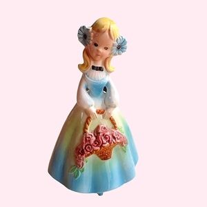 Vintage girl in blue dress figurine